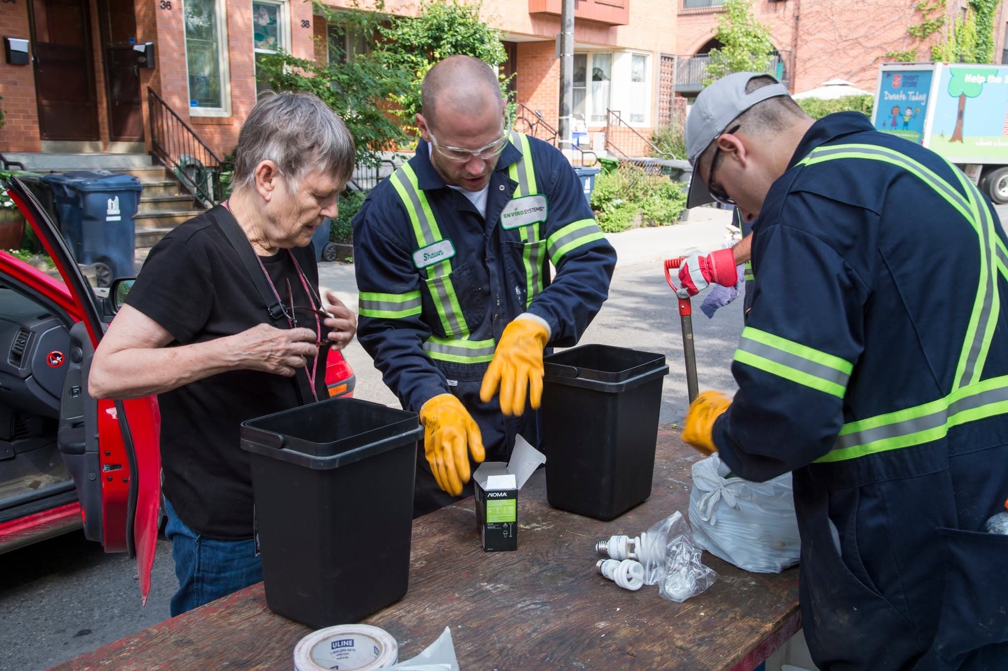 City crew working with a resident on the street